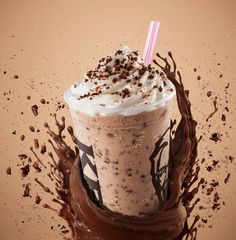 a milkshake with whipped cream and chocolate sprinkles