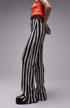 Bold stripes draw attention to these wide-leg trousers that add instant style points to in-office or off-duty looks. 100% polyester Machine wash, line dry Made in the UK Style Patterned Pants, Striped Wide Leg Formal Bottoms, Chic Wide Leg Bottoms With Vertical Stripes, Chic Wide-leg Striped Pants, Chic Wide-leg Pants With Vertical Stripes, Striped Full-length Bottoms For Work, Striped Wide Leg Pants For Night Out, Striped Bottoms For Spring Formal, Chic Striped Pants For Night Out