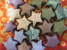 several different colored stars are arranged on a table