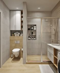 a bathroom with a toilet, sink and shower stall in the corner next to it