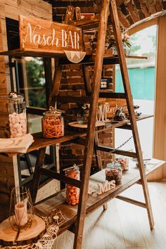 a wooden shelf with candy bar items on it