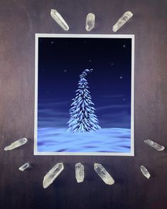 an image of a snow covered tree surrounded by crystal points and ice cubes on a wooden surface