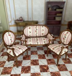 a doll house living room with furniture and checkered floor