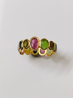 Natural Multi Tourmaline Eternity Band 925 Sterling Silver - Handmade Ring- Multi Gemstone Ring- 18k Gold flash ring Minimalist Ring Active PRODUCT DETAILS :- > Material - 925 Sterling Silver > Gemstone - Tourmaline > Gemstone Weight- 8.9 ct > Gemstone Size- 4.6 mm > Gemstone Shape- Oval > Gross Weight - 2.8 Grm > Setting - Bezel setting Production Time: Each of our pieces are made to order. Due to this, it takes 3 to 5 business days after your payment clears to complete your order. Free Shippin Flash Ring, Multi Gemstone Ring, Jewelry Lookbook, Ring Minimalist, Minimalist Ring, Tourmaline Gemstone, Minimalist Rings, Eternity Band, Eternity Bands