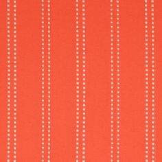 an orange and white striped fabric with small dots on the bottom, in rows of vertical stripes