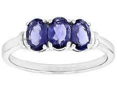 0.97ctw Oval Iolite Platinum Over Sterling Silver 3-Stone Ring. Measures Approximately 0.51"L x 0.18"W. Not sizeable. 3 Stone Rings, Stone Ring, Stone Rings, Platinum, Sterling Silver, Ring, Stone, Silver, Blue