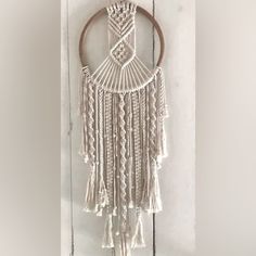 a macrame hanging on the side of a door