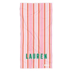 an orange and white striped towel with the word lauren on it in green lettering that reads lauren