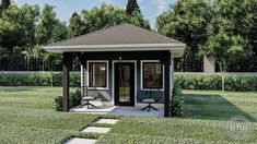 a small black and white gazebo sitting in the middle of a field with two chairs