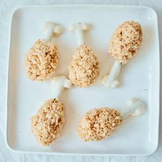 four different types of food on a white plate