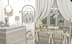 a baby's room is decorated in white and gold