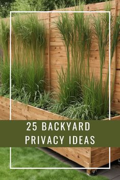 a wooden planter filled with lots of green plants and grass next to a fence