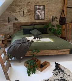 a bed room with a neatly made bed and lots of plants on the floor next to it