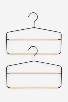 two clothes hangers on a white background