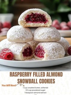 raspberry filled almond snowball cookies on a plate