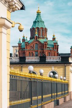 an ornate building with gold domes on top