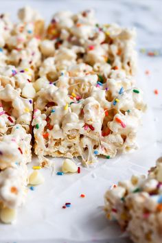 some kind of candy bar with sprinkles on the top and white frosting