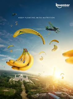 bananas are flying through the air with parachutes in the sky over a city and an airplane