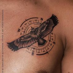 a close up of a man's chest with a bird on it