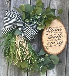 Rustic sympathy wreath with a wooden sign that says " Those we love don't go away they walk beside us every day". This beautifully crafted wreath, is  handmade on a grapevine base and adorned with artificial silk eucalyptus and ayy wooden heaven sign attached. This is a thoughtful and heartfelt way to honor the memory of a loved one. Perfect for use as a sympathy gift or memorial decoration, this wreath is a lasting tribute that will bring comfort and solace to those grieving the loss of someone Sympathy Wreath, Holiday Deals, Sympathy Gifts, Door Wreath Hanger, Wooden Sign, Memorial Gifts, Door Hangers, Door Wreaths, Wooden Signs