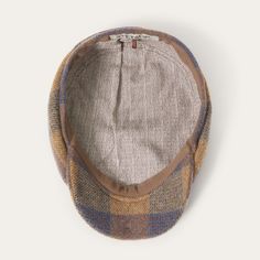 Handcrafted in Germany, our Hatteras is defined by its impeccable stitching and sense of bold simplicity. Made from high-quality 100% wool, this Hatteras is ideal for brisk temperatures, with an understated check pattern that brings style and sophistication wherever you go. The 8-piece construction and sewn-down brim are traditional features inspired by the iconic Newsboy Cap, which in turn took its cues from the Scottish Bonnet-style hats and Irish Flat Caps worn by farmers and laborers of the Flat Caps, Scotch Bonnet, Cap Collection, Casual Bottoms, Denim Boots, Denim Outerwear, Newsboy Cap, Flat Cap, 14th Century