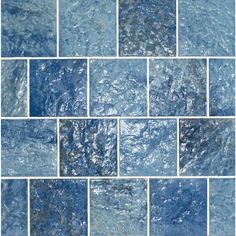 a blue tile wall with water running down it