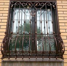 a window with iron bars on the outside