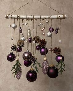 an assortment of christmas ornaments hanging from a wall