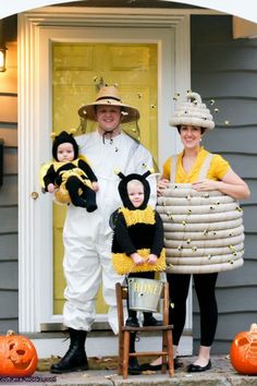 a man and two children dressed up in costumes