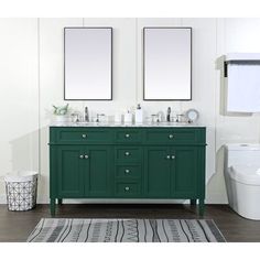 a bathroom with two mirrors above the sinks and a rug on the floor next to it