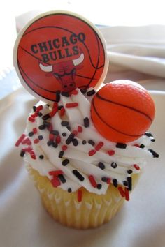 a cupcake with sprinkles and a basketball on top