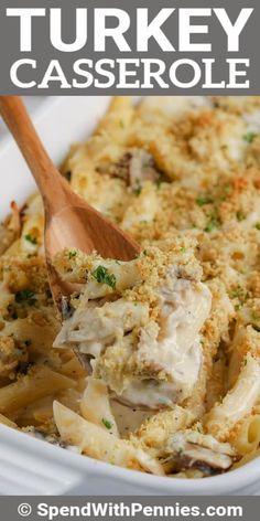 a white casserole dish filled with chicken and pasta