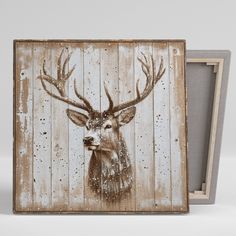 an old wooden box with a deer's head painted on it