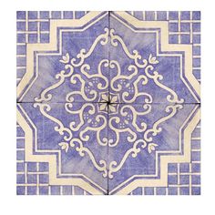 a blue and white tile with an intricate design