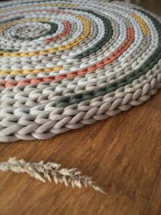 a close up of a rug on a wooden floor