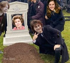 a group of people standing around a grave with a photo of harry potter on it