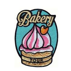 the logo for bakery tour iron on