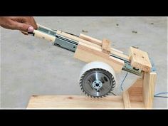 someone is using a circular saw to cut wood