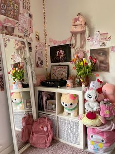 there are many stuffed animals on the shelves in this room, including teddy bears and other toys