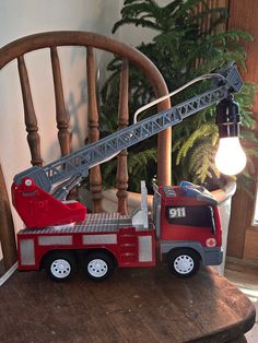 a toy fire truck is sitting on a table