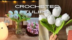 crocheted tulips are displayed in vases on a table with flowers