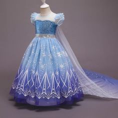 a blue and white dress with snowflakes on it