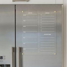 a stainless steel refrigerator with a checklist on the front and side panels that say work to do