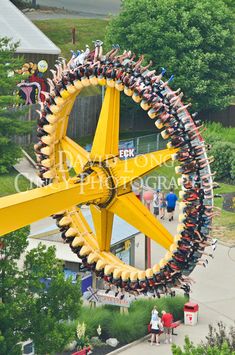 an amusement park ride with people riding on it