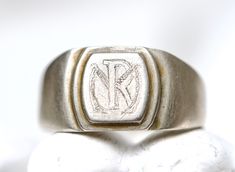 This charming antique signet ring is already engraved with a monogram of the initials MR or RM Roughly 19mm in inner diameter, according to the wikipedia that makes it a US size 9 and a UK size S. In great solid vintage condition, beautifully and naturally aged, slightly oxidised by time. No marks or stamps that I can spot, however tests positive for silver. Quite light and comfortable to wear, yet sturdy. For more vintage and antique signet rings: https://www.etsy.com/uk/shop/Meanglean?ref=sell Vintage Initial Ring For Anniversary, Vintage Stamped Initial Ring For Anniversary, Vintage Stamped Engraved Ring For Formal Occasions, Vintage Engraved Ring For Formal Occasions, Formal Vintage Engraved Stamped Ring, Vintage Etched Signet Ring, Vintage Stamped Signet Ring For Formal Occasions, Vintage Formal Stamped Signet Ring, Vintage Signet Ring With Initials