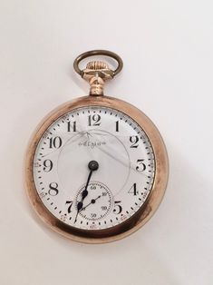 "This is a truly wonderful, antique, engraved, open-face, \"Father Time\" Pocket Watch by Elgin National Watch Co., made in 1900. As seen in our photos, the glass crystal is cracked. And the watch winds, but we can't get it to click over and run (we are not repairers). But as you can also see in our photos, it is otherwise in beautiful condition inside and out, no decay or other damage. It features a separate dial for seconds, and heat-blued steel minute and hour hands. The die-engraved floral a Ruby Jewel, Open Face, Father Time, Internal Design, Blue Steel, Watch Faces, Roman Numerals, Bird Design, Crystal Glass