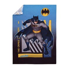 batman bedding set with blue background and yellow lettering on the bottom right hand side