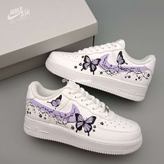 Step into style with the Nike Air Force 1 Purple Butterfly Custom. Crafted with precision and attention to detail, these shoes are the ultimate statement piece for any sneaker enthusiast. The vibrant purple butterfly design adds a unique touch to the classic silhouette, making these shoes a must-have for any fashion-forward individual. Elevate your look and stand out from the crowd with these custom Nikes. ★ Brand new with box ★ Each pair is unique and one of a kind ★ Each pair is personally han Nike Air Force 1 Purple, Purple Nike Shoes, Cute Converse Shoes, Cute Casual Shoes, Casual Shoes Women Sneakers, Nike Shoes Women Fashion, Pretty Sneakers, Butterfly Shoes, Nike Fashion Shoes