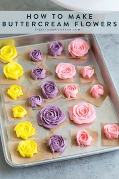 the cupcakes are decorated with pink, yellow and purple icing on paper