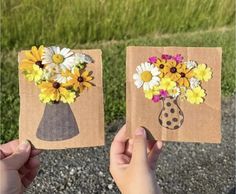 two handmade cards with flowers in vases on them, one is brown and the other is white